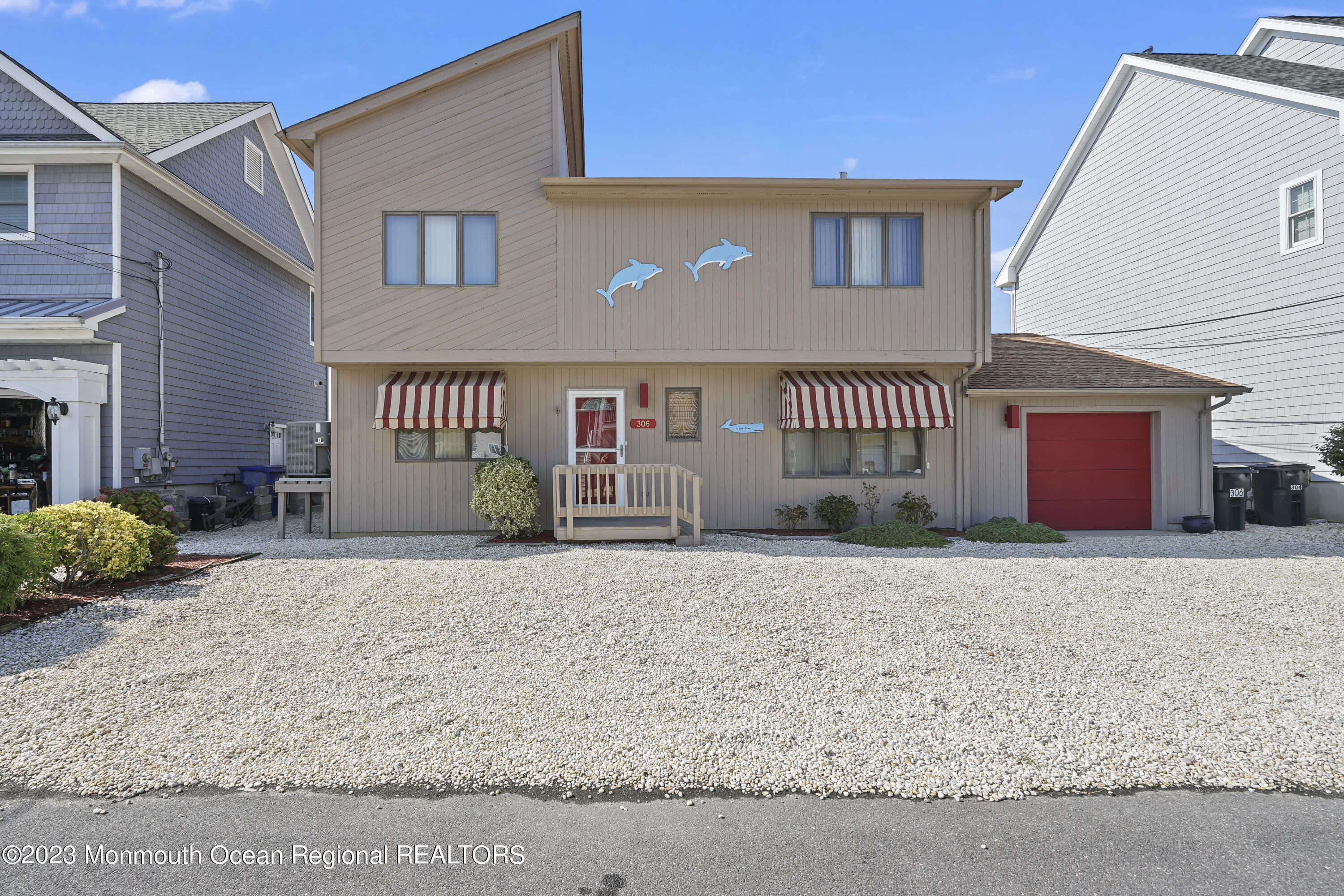 306 Ormond Drive Lavallette, NJ 08735 - Photo 11 of 49 a front view of a house with a yard and garage