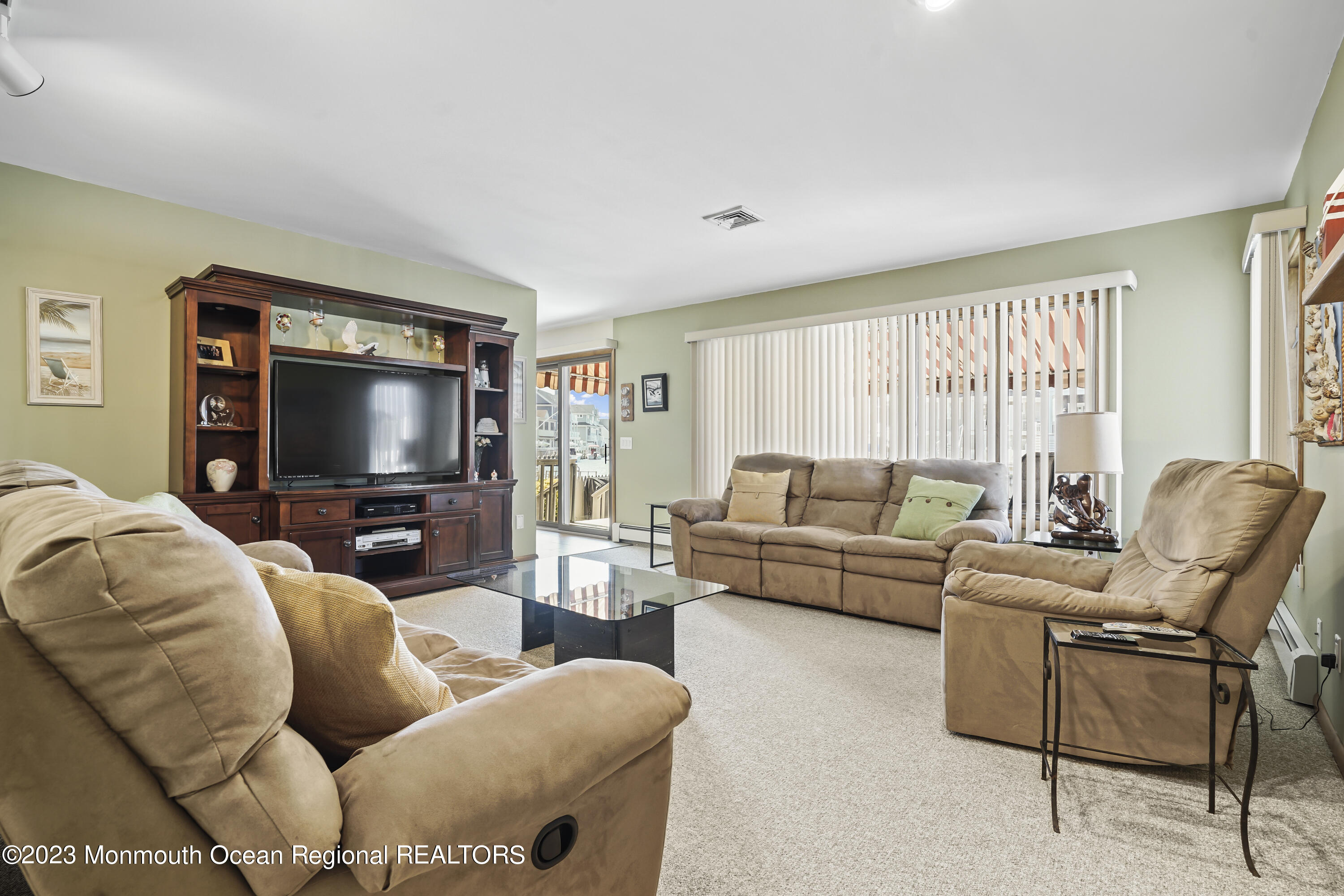 306 Ormond Drive Lavallette, NJ 08735 - Photo 15 of 49 a living room with furniture and a flat screen tv