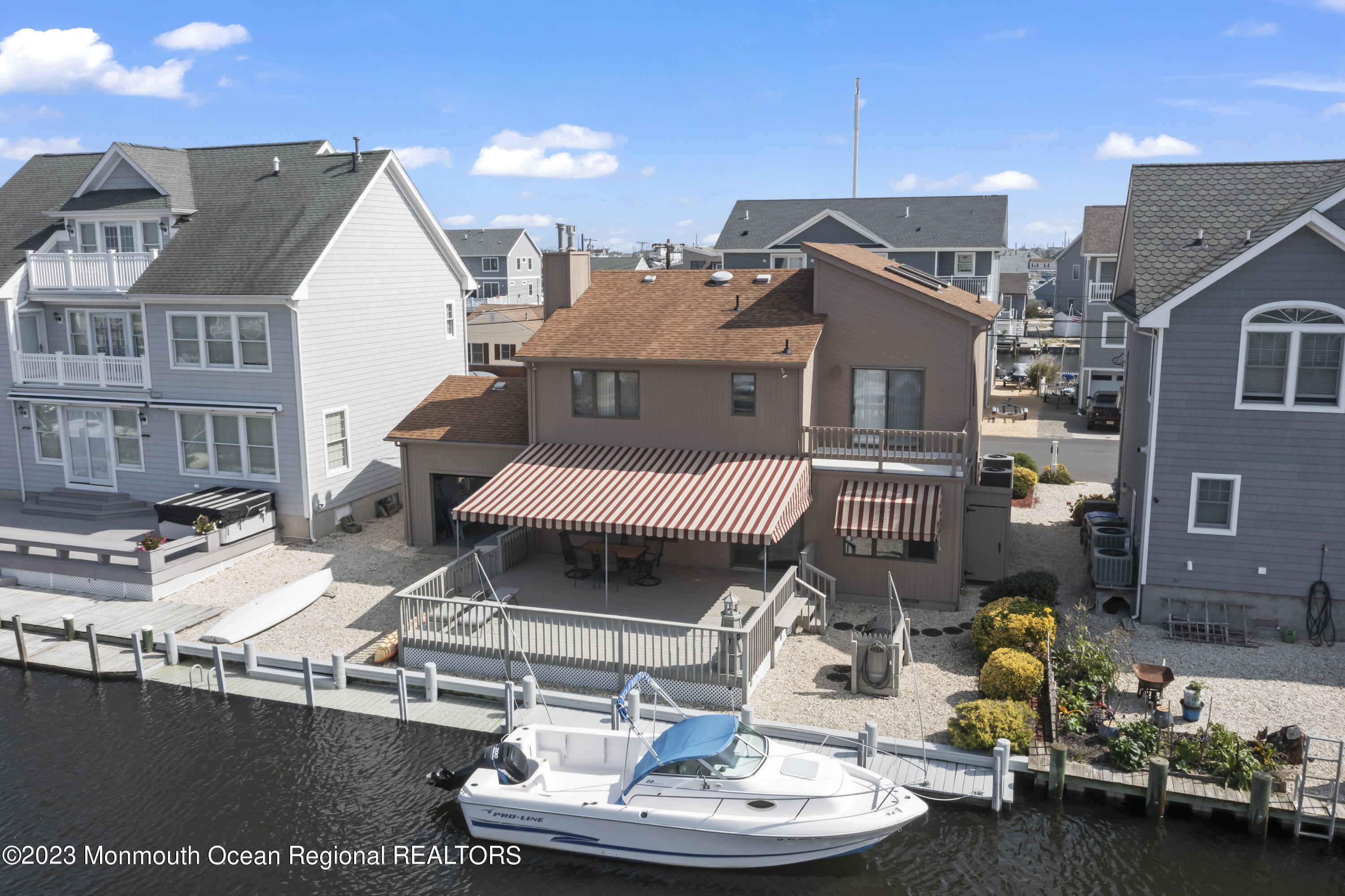 306 Ormond Drive Lavallette, NJ 08735 - Photo 27 of 49 a view of a patio with table and chairs and a barbeque