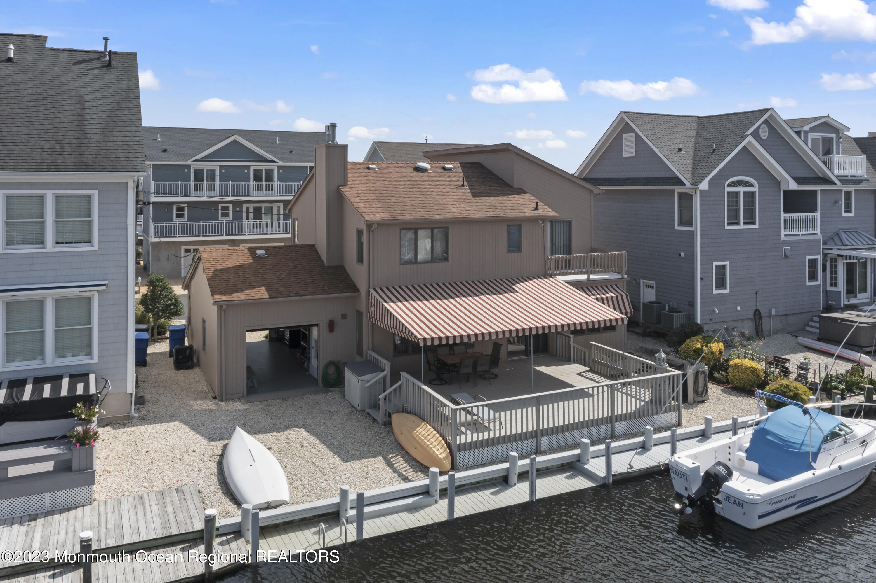 306 Ormond Drive Lavallette, NJ 08735 - Photo 28 of 49 a view of a patio with table and chairs near a barbeque