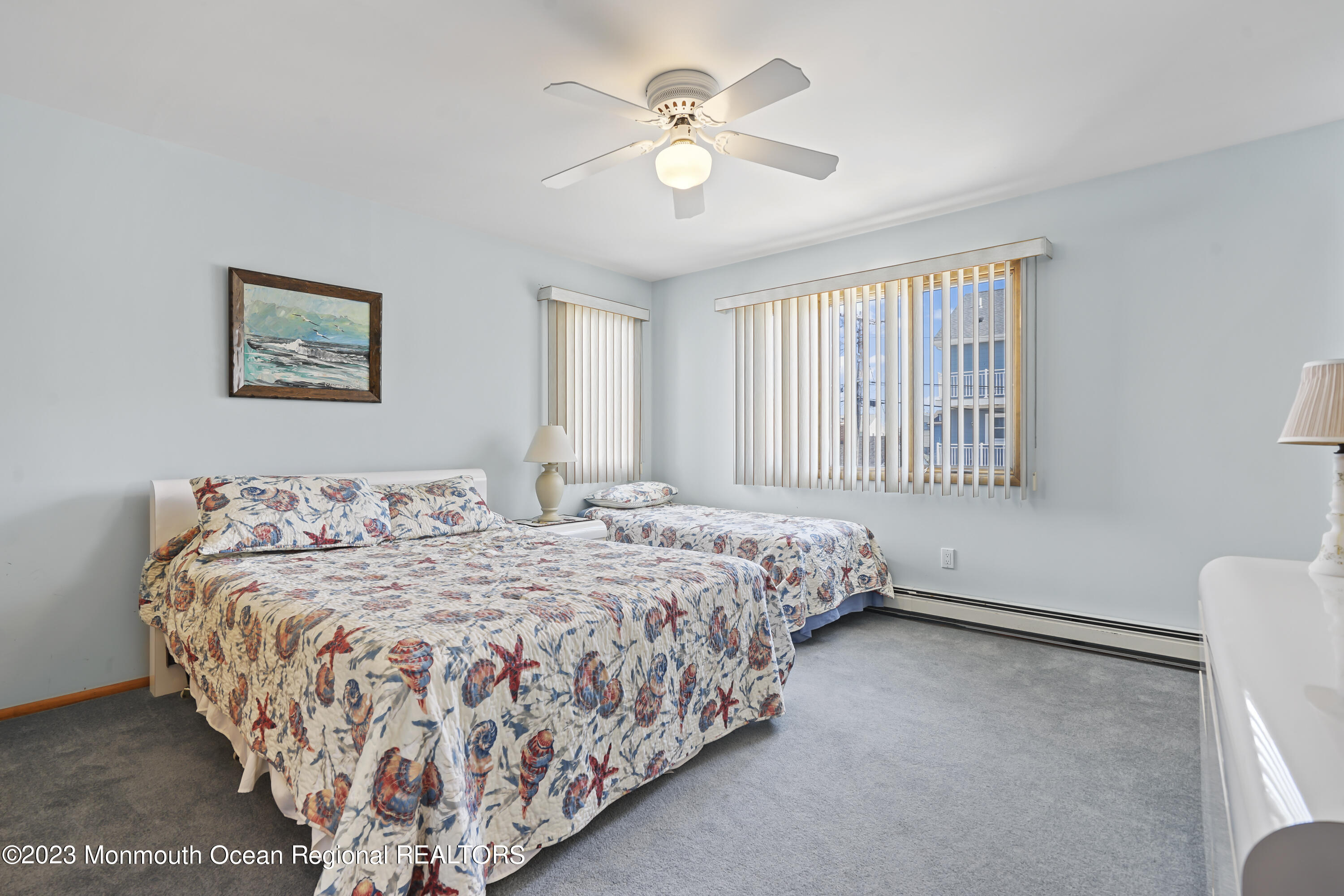 306 Ormond Drive Lavallette, NJ 08735 - Photo 5 of 49 a bedroom with a bed and a chandelier
