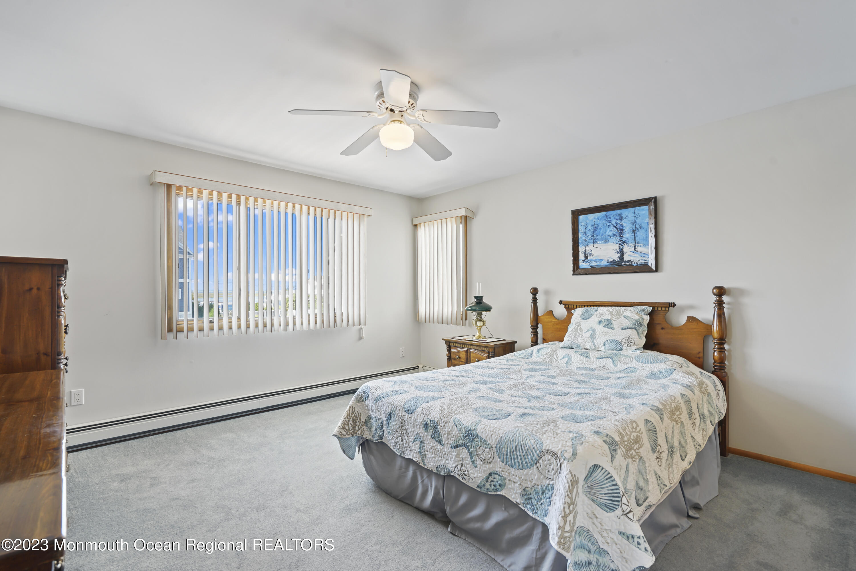 306 Ormond Drive Lavallette, NJ 08735 - Photo 7 of 49 a bedroom with a large bed and a window