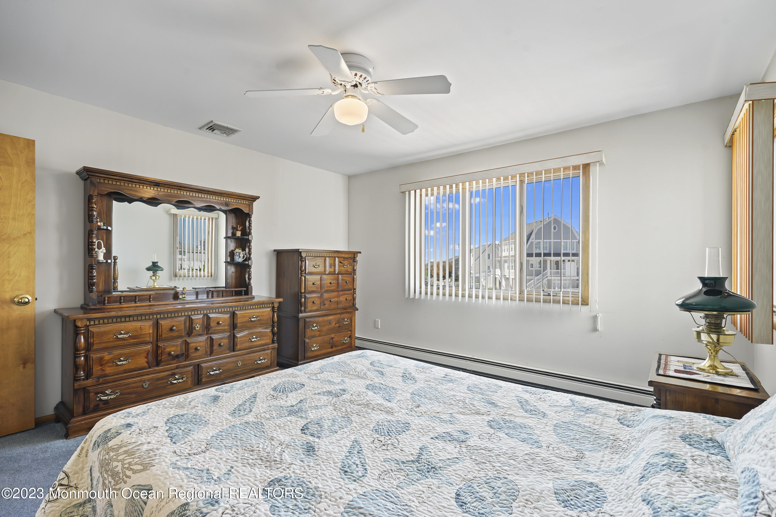 306 Ormond Drive Lavallette, NJ 08735 - Photo 8 of 49 a bedroom with a large bed and dresser