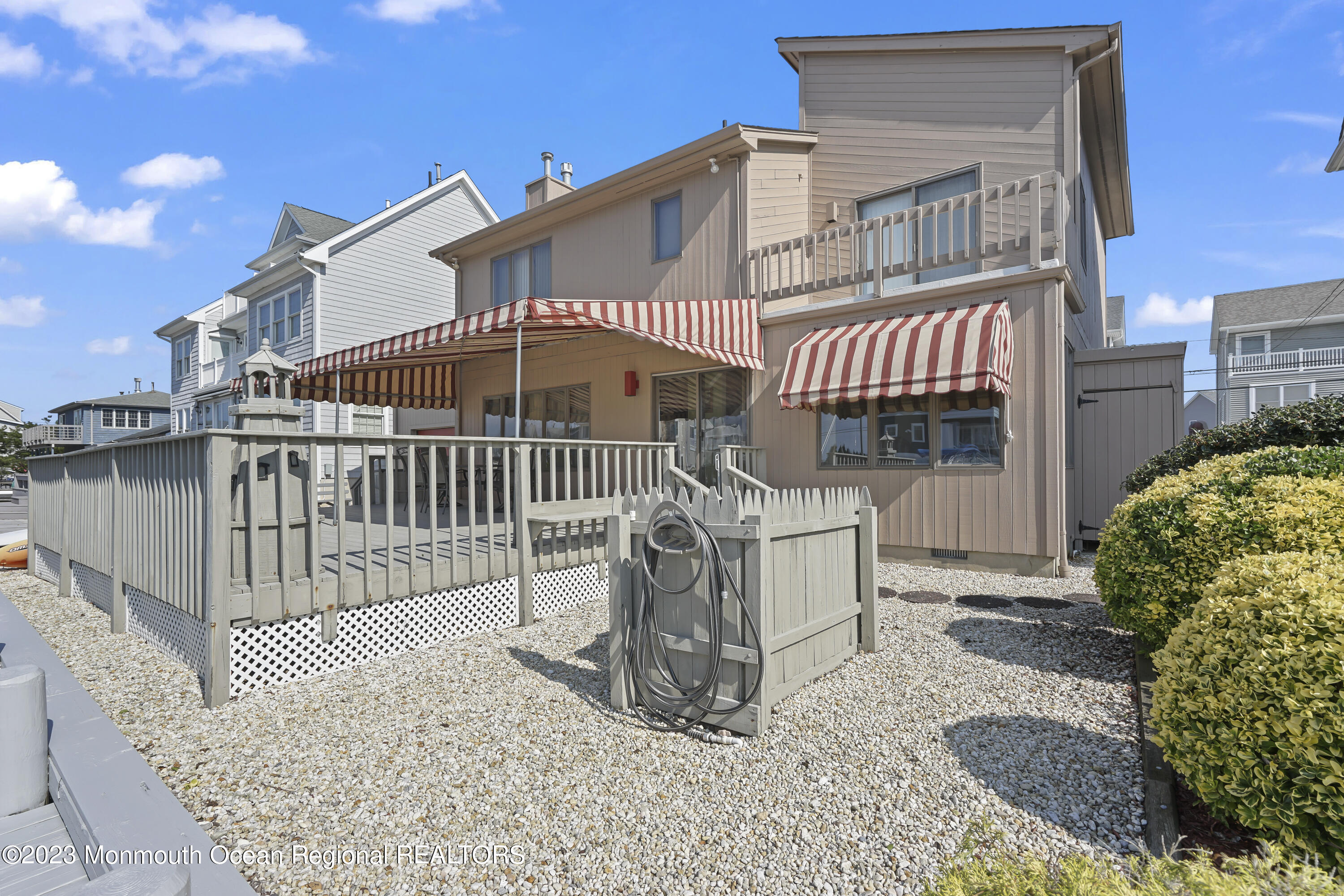 306 Ormond Drive Lavallette, NJ 08735 - Photo 9 of 49 a view of a house with a wooden deck