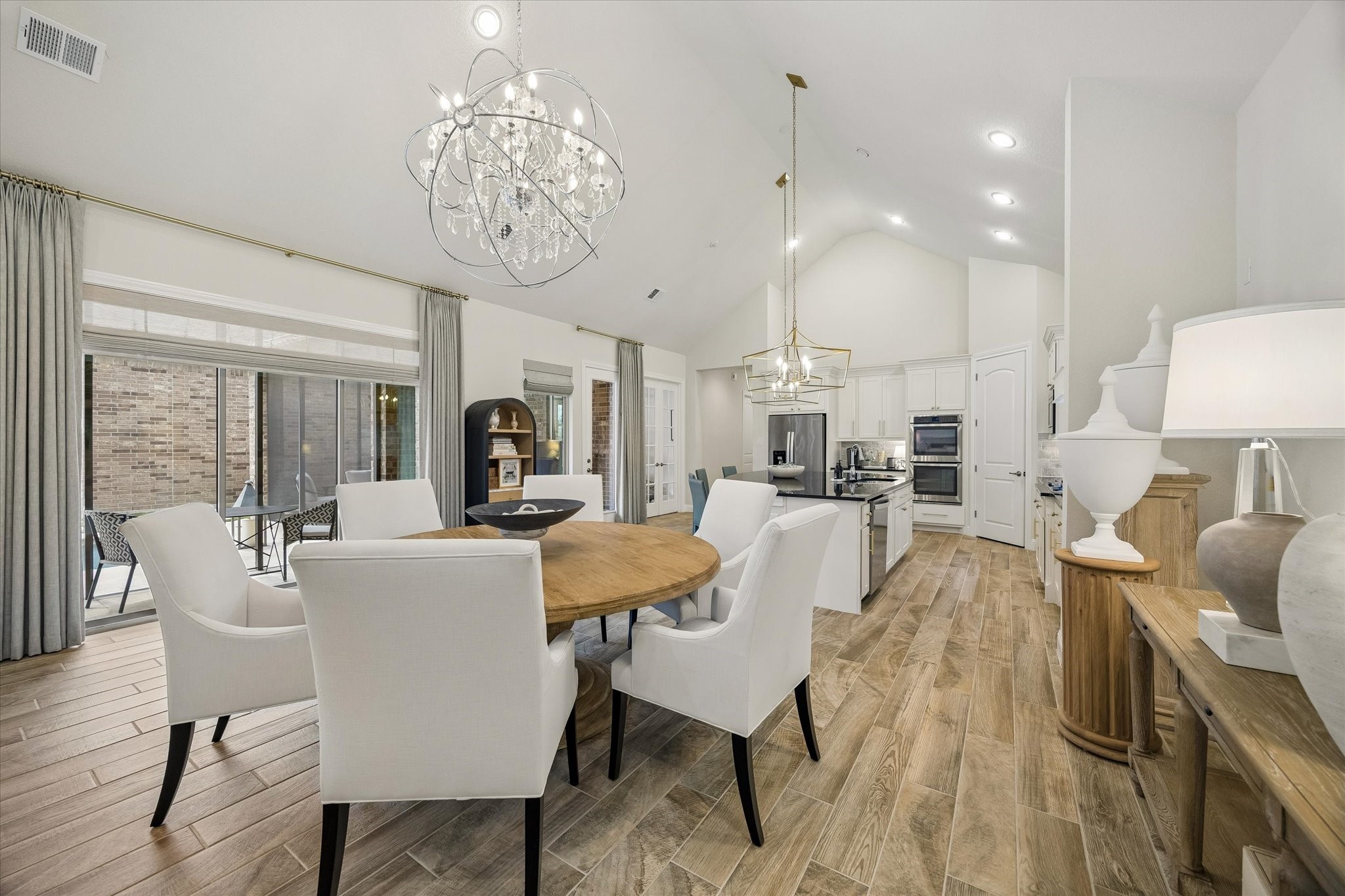 7418 Kearney Hill Lane Spring, TX 77389 - Photo 6 of 35 The dining room is highlighted by an oversized designer chandelier, the perfect centerpiece for intimate dinners with friends.