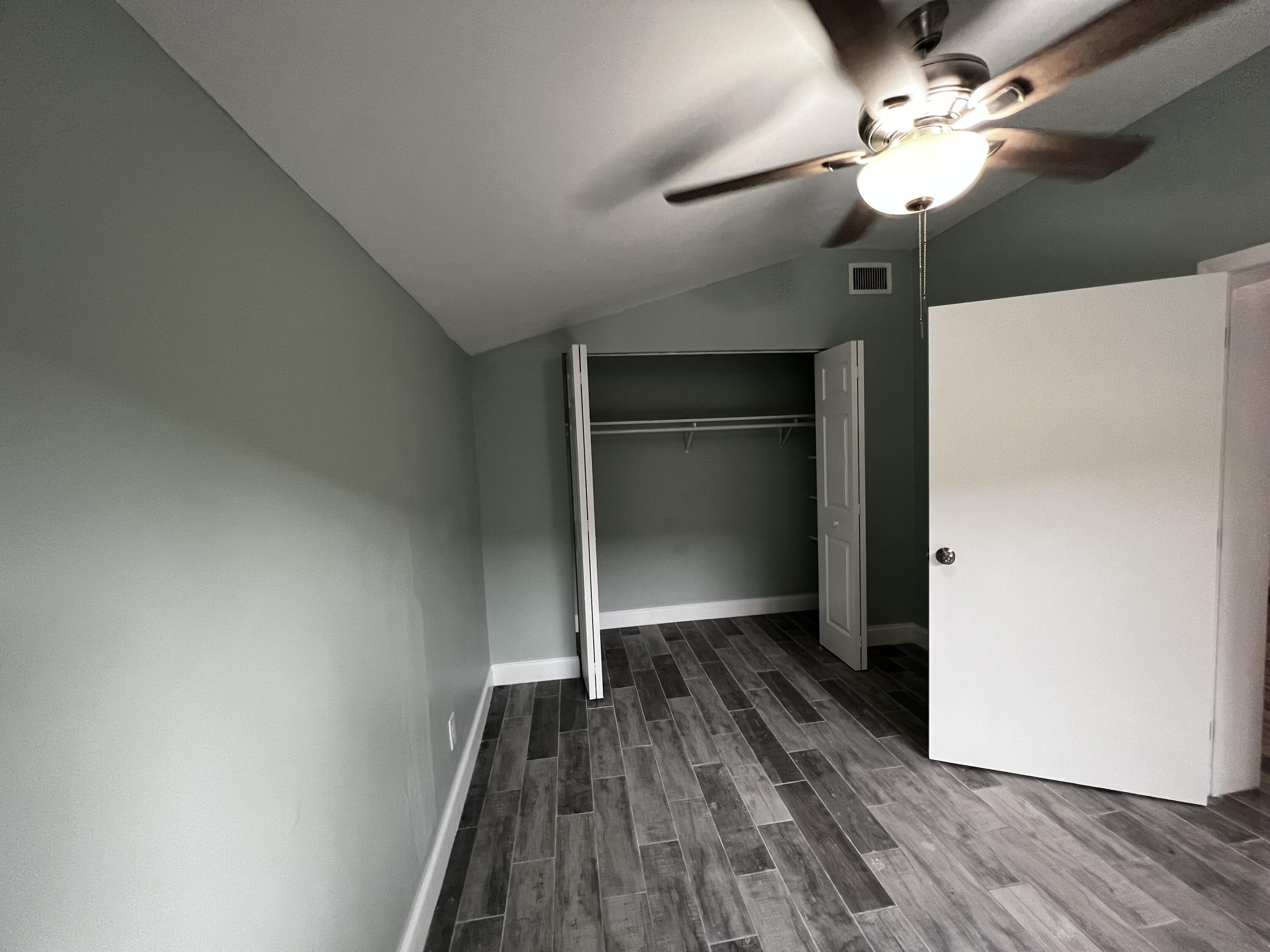 1147 Goldenrod Road Wellington, FL 33414 - Photo 2 of 18 a view of empty room with wooden floor