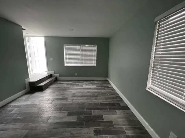 an empty room with windows