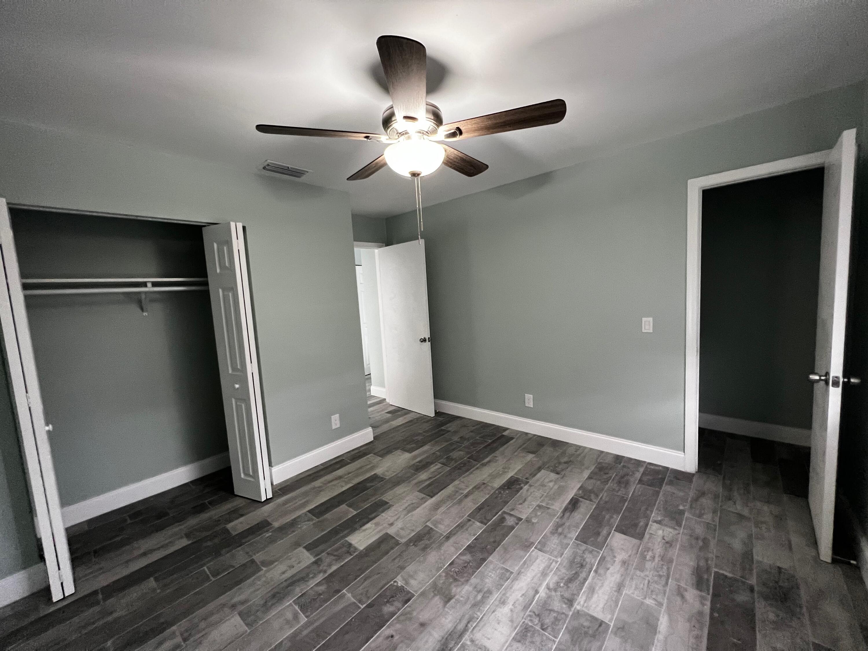 1147 Goldenrod Road Wellington, FL 33414 - Photo 10 of 18 wooden floor in an empty room