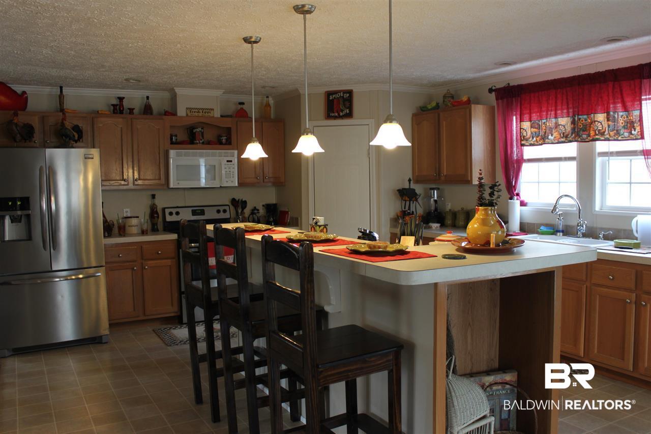 9380 Spice Pond Road Eight Mile, AL 36613 - Photo 26 of 36 View of spacious kitchen from great room.