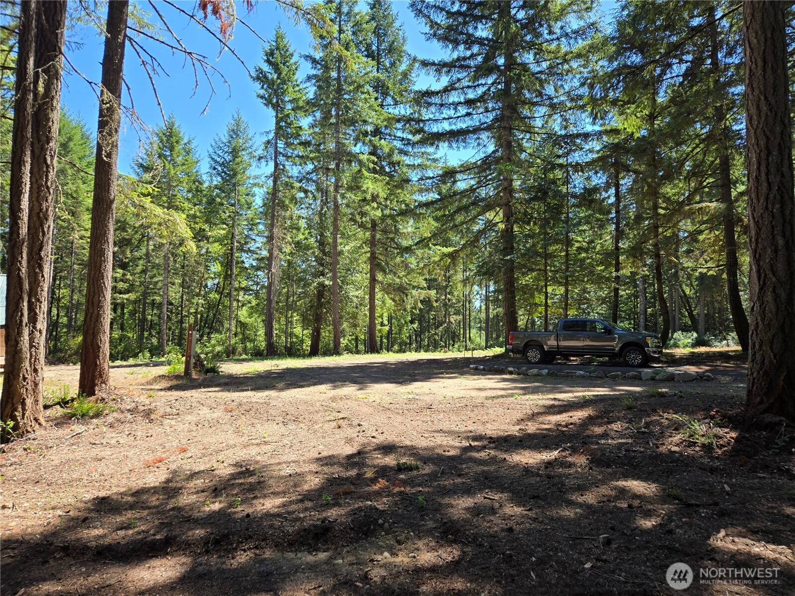 19205 30th Street Southwest Lakebay, WA 98349 - Photo 11 of 19 a backyard of a house with trees and houses
