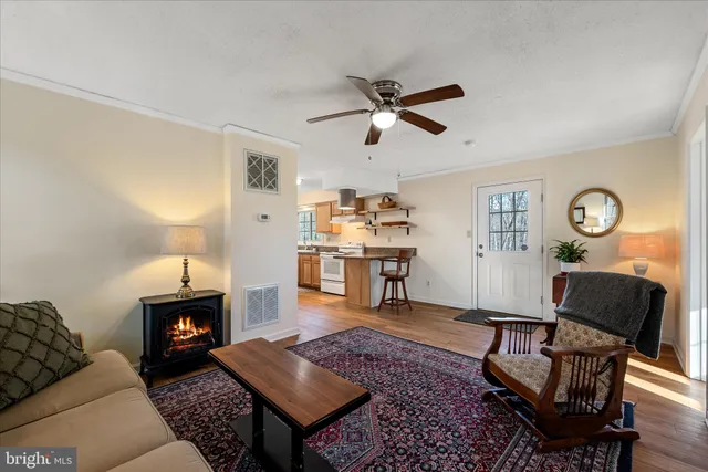 a large kitchen with a table and chairs