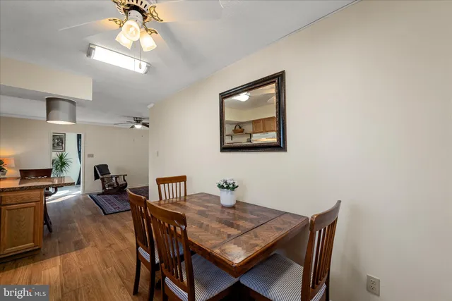 a kitchen with sink a refrigerator and cabinets