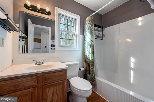 a room that has a bed and a table in it