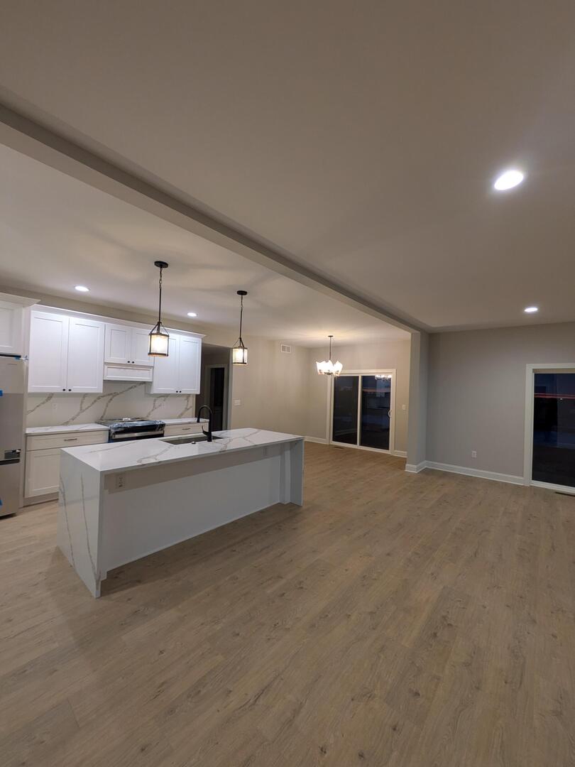 675 South Regulators Street Creston, IL 60113 - Photo 11 of 27 a large kitchen with stainless steel appliances a large counter top