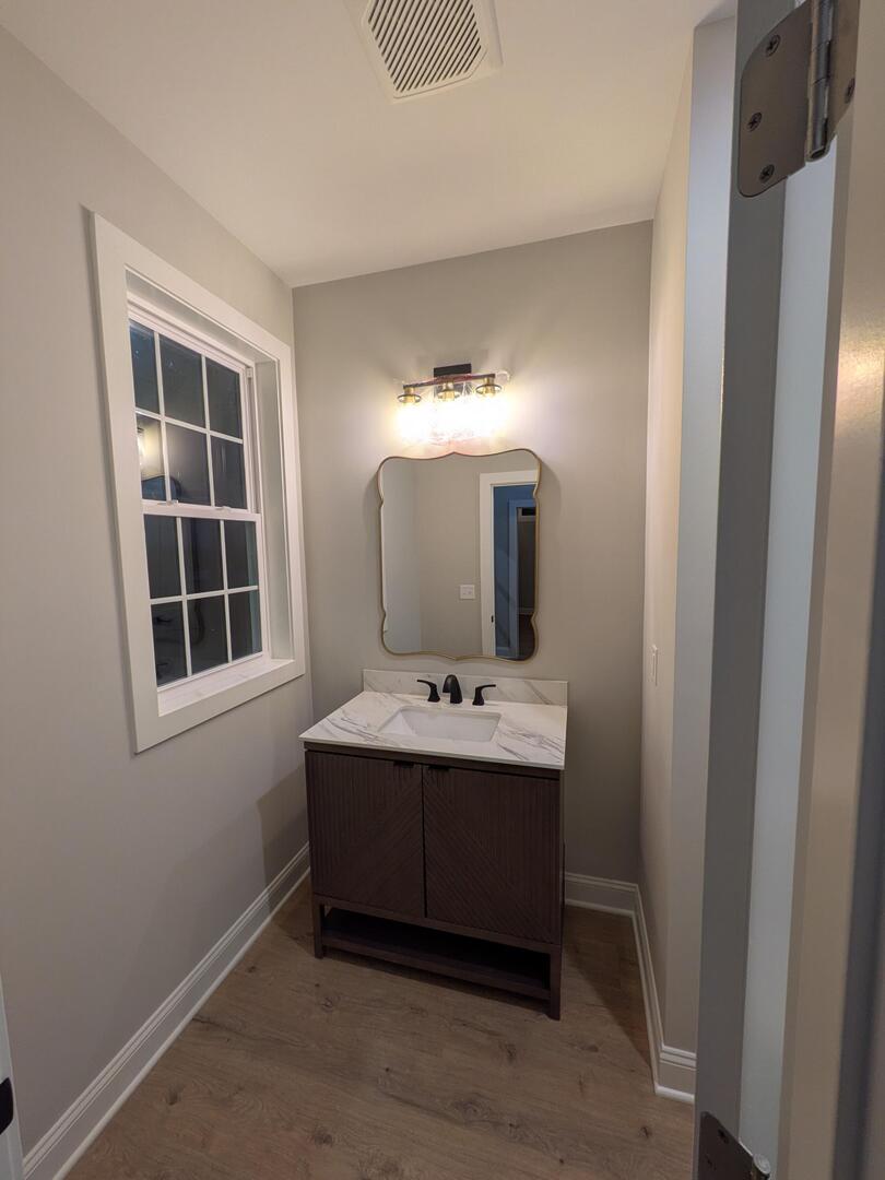 675 South Regulators Street Creston, IL 60113 - Photo 12 of 27 a bathroom with a sink and a mirror