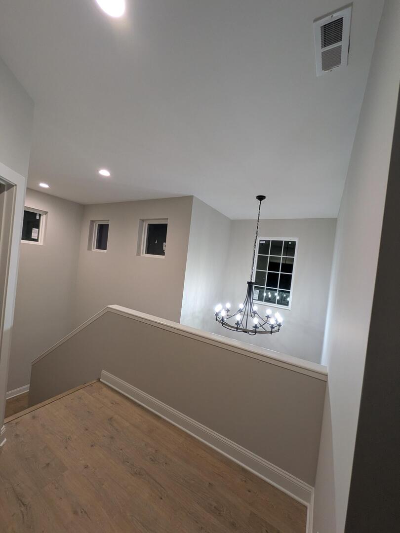 675 South Regulators Street Creston, IL 60113 - Photo 19 of 27 a view of a livingroom with wooden floor and window