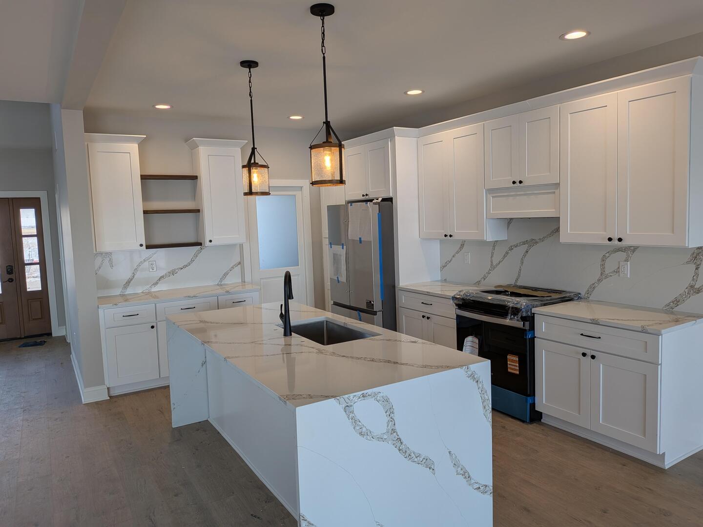 675 South Regulators Street Creston, IL 60113 - Photo 3 of 27 a kitchen with a sink stove and refrigerator