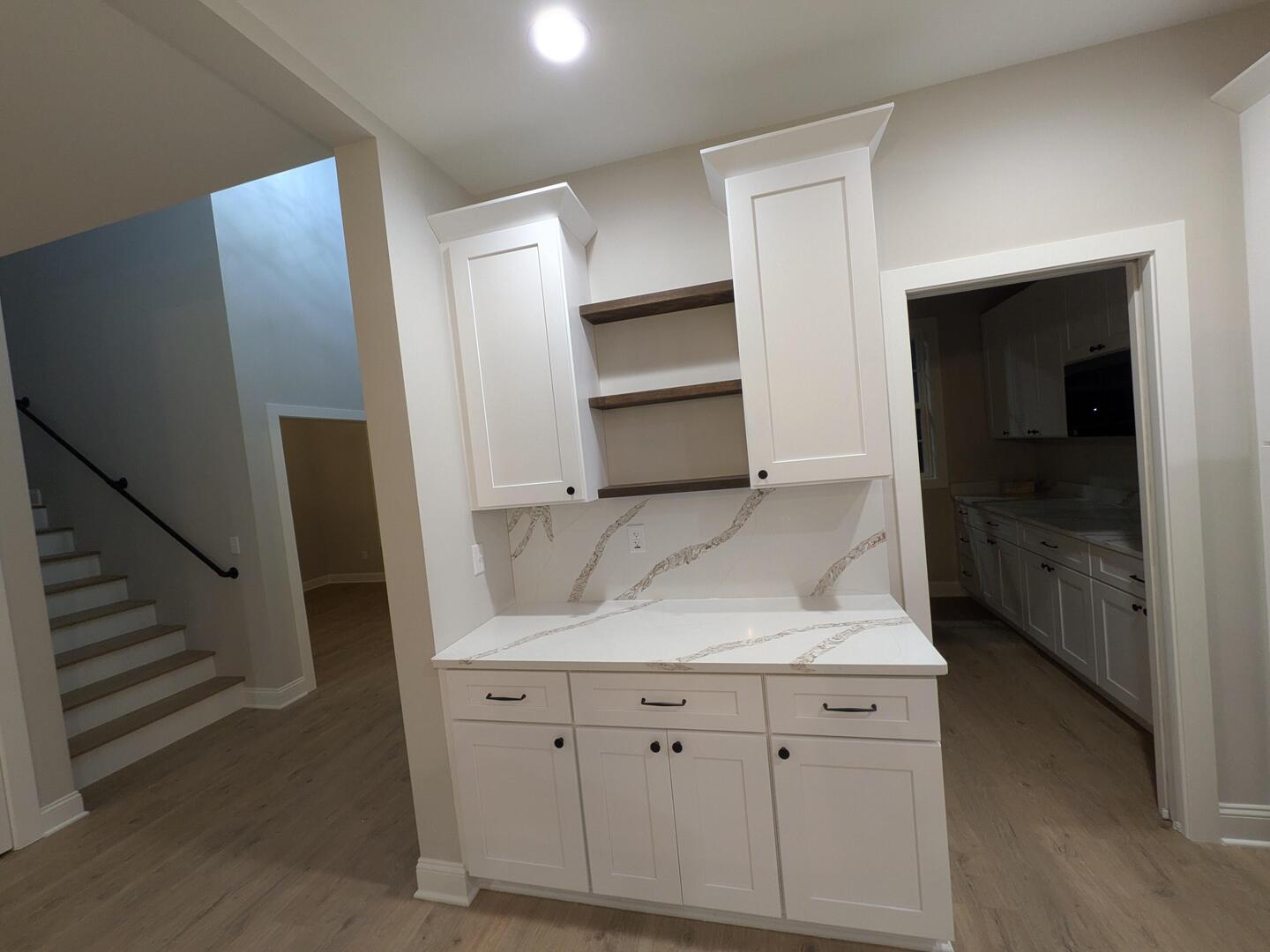 675 South Regulators Street Creston, IL 60113 - Photo 8 of 27 a kitchen with white cabinets and counter space