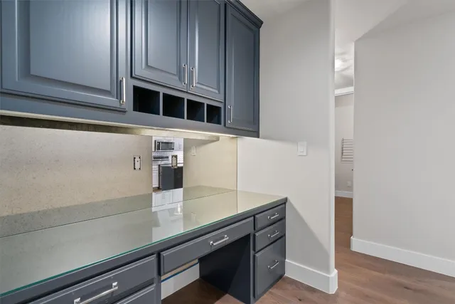 a view of cabinets and wooden floor
