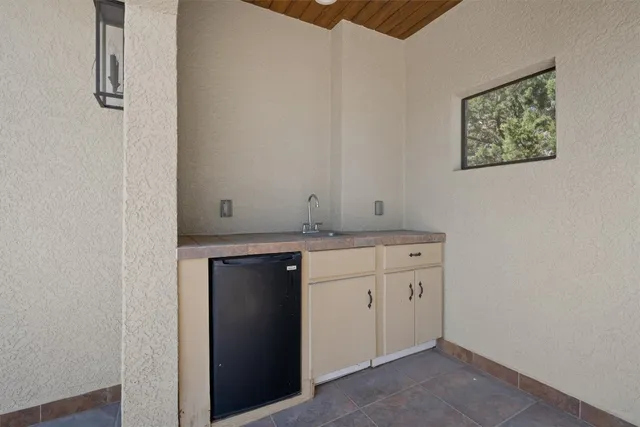 a view of cabinets and wooden floor