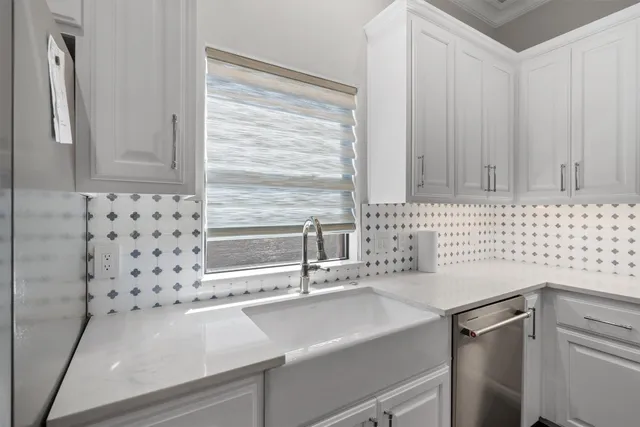 a view of a sink and a refrigerator