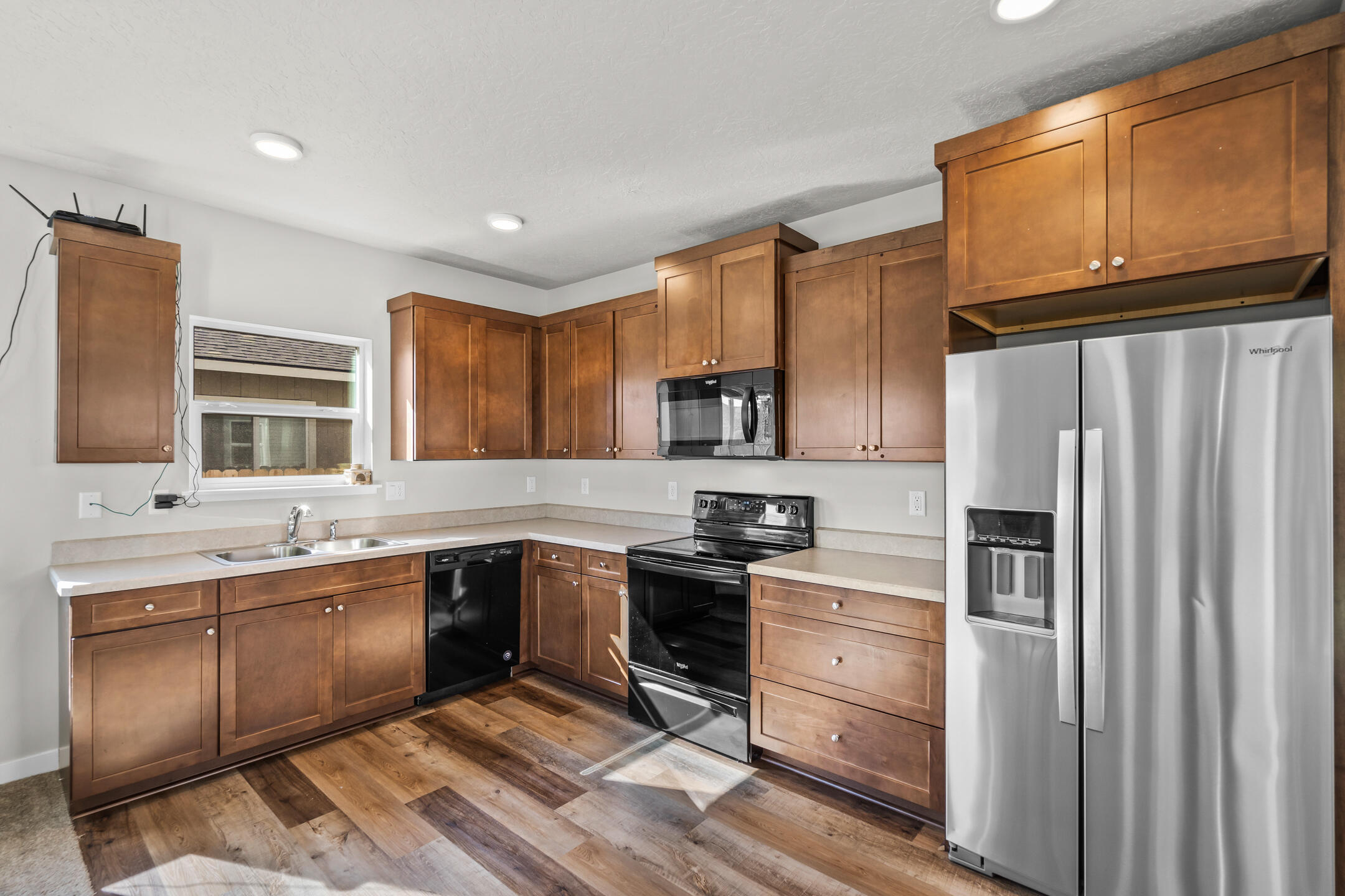 2534 Northeast Colleen Road Prineville, OR 97754 - Photo 12 of 26 a kitchen with stainless steel appliances granite countertop a refrigerator sink and cabinets