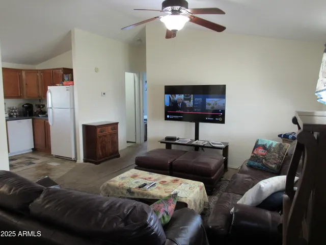 a bedroom with bed and a tv