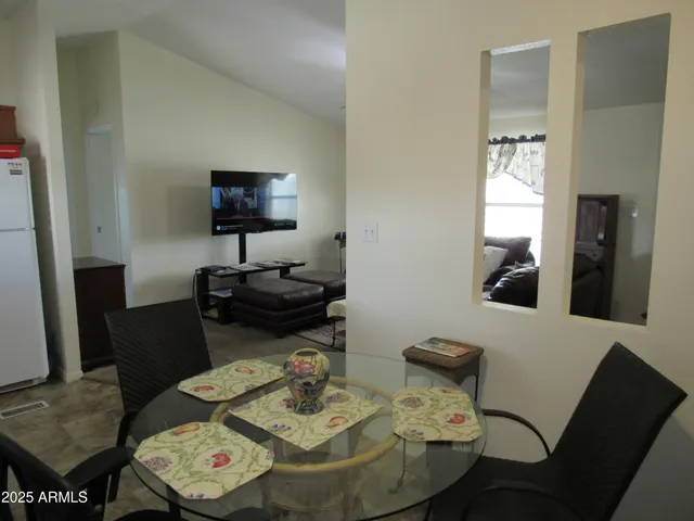 a view of a dining room with furniture