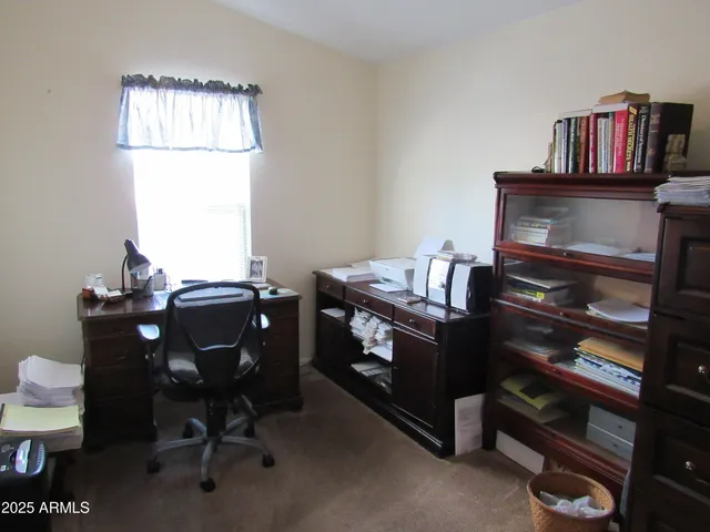 a view of a workspace with furniture