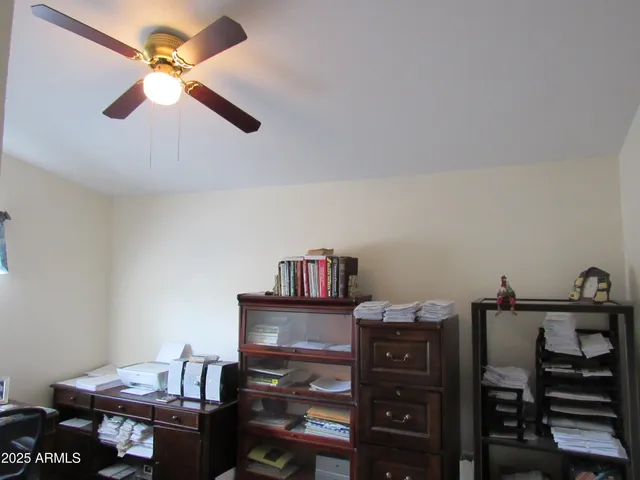 a view of a workspace with furniture