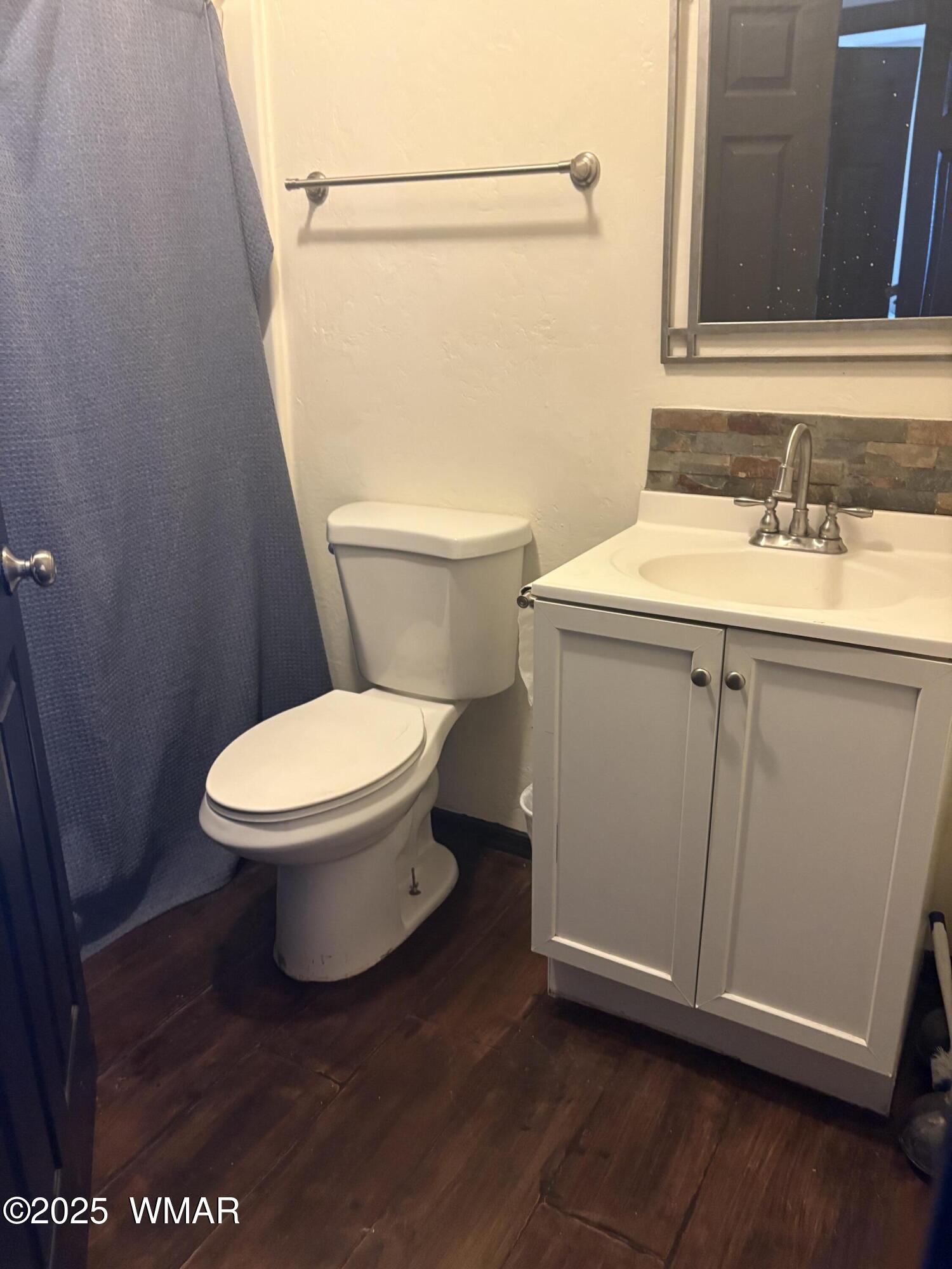 1 B County Road Concho, AZ 85924 - Photo 11 of 21 a white toilet sitting next to a bathroom sink
