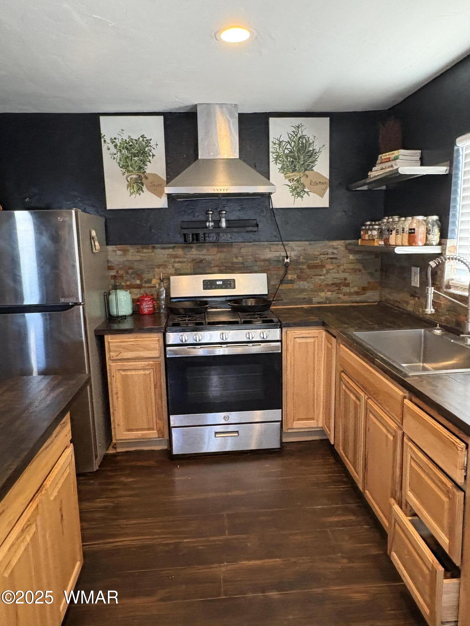1 B County Road Concho, AZ 85924 - Photo 2 of 21 a kitchen with stainless steel appliances a stove a sink and a microwave