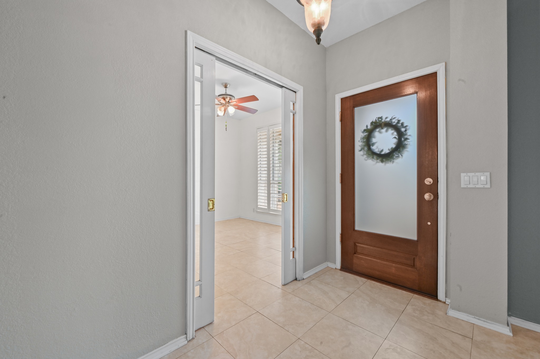 5313 Moon Shadow Drive Austin, TX 78735 - Photo 6 of 30 Inviting entryway with tile flooring and a wood-panel front door featuring a frosted glass insert