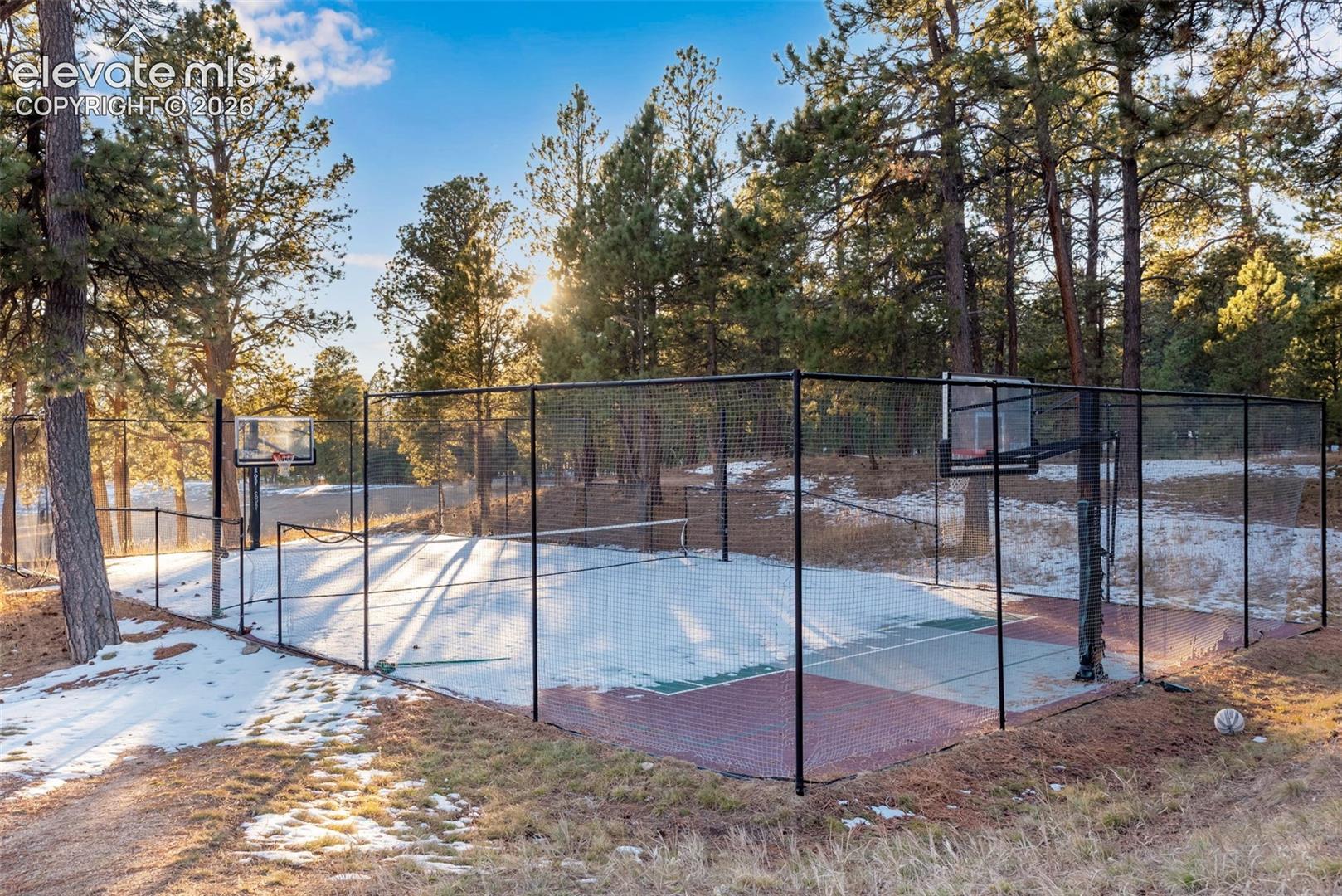 16075 Winding Trail Road Colorado Springs, CO 80908 - Photo 48 of 49 Community basketball/tennis/pickleball courts located next to the club house