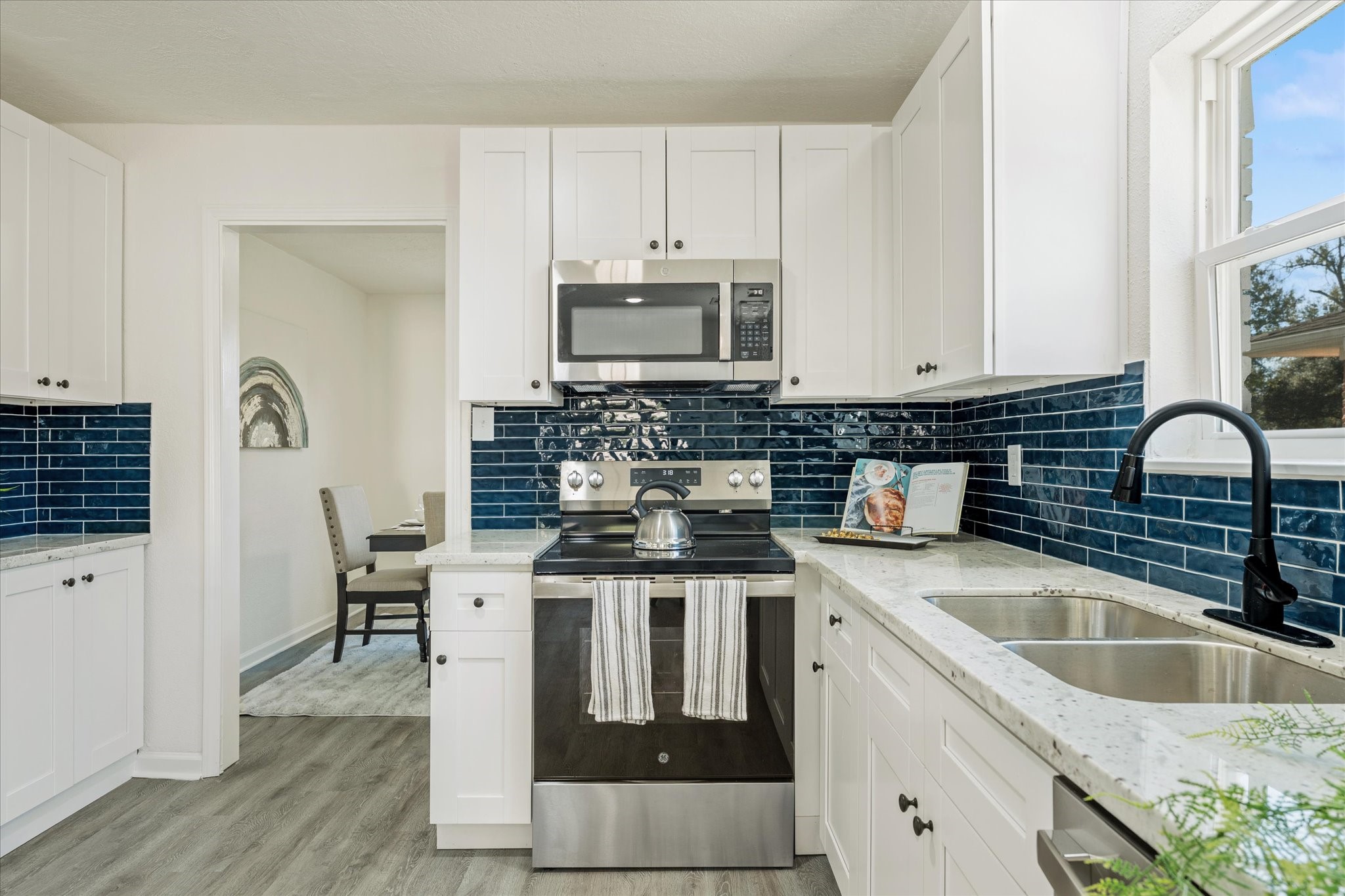 6030 Beaudry Drive Houston, TX 77035 - Photo 22 of 45 a kitchen with appliances a sink and cabinets