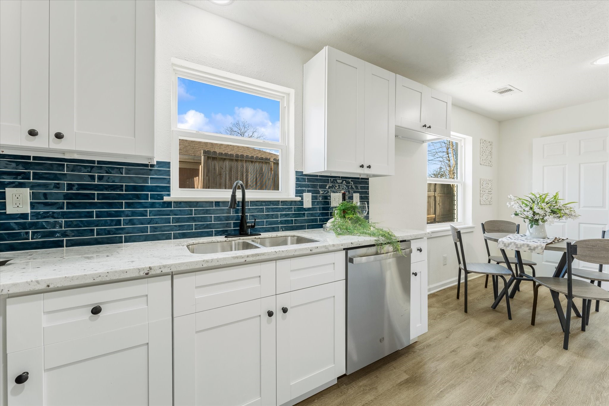 6030 Beaudry Drive Houston, TX 77035 - Photo 24 of 45 a kitchen with a sink and cabinets