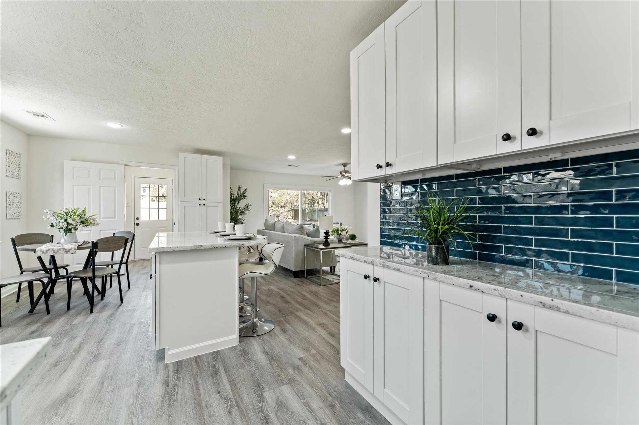 6030 Beaudry Drive Houston, TX 77035 - Photo 25 of 45 a kitchen with sink cabinets and wooden floor