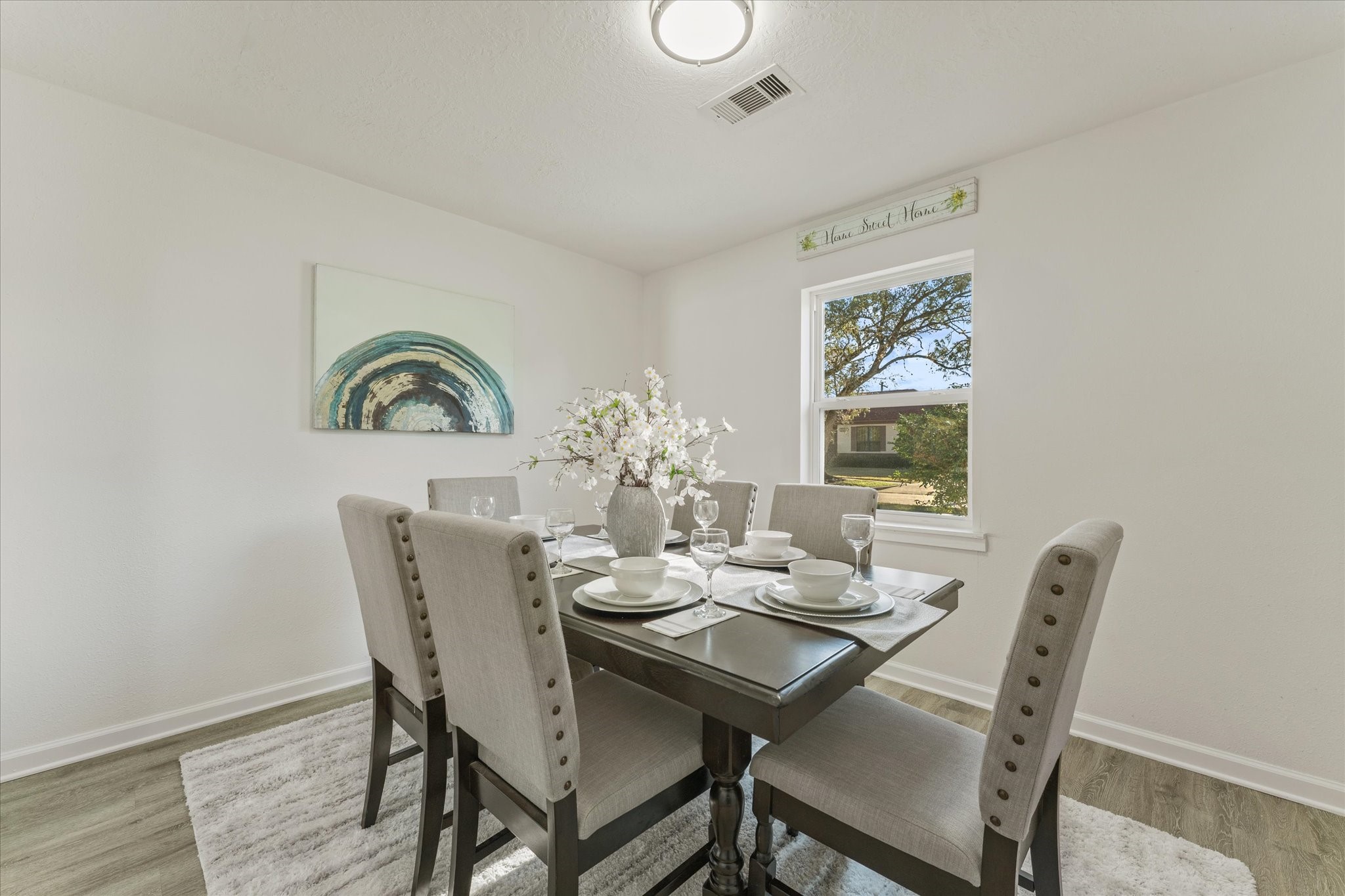 6030 Beaudry Drive Houston, TX 77035 - Photo 26 of 45 a view of a dining room with furniture and wooden floor