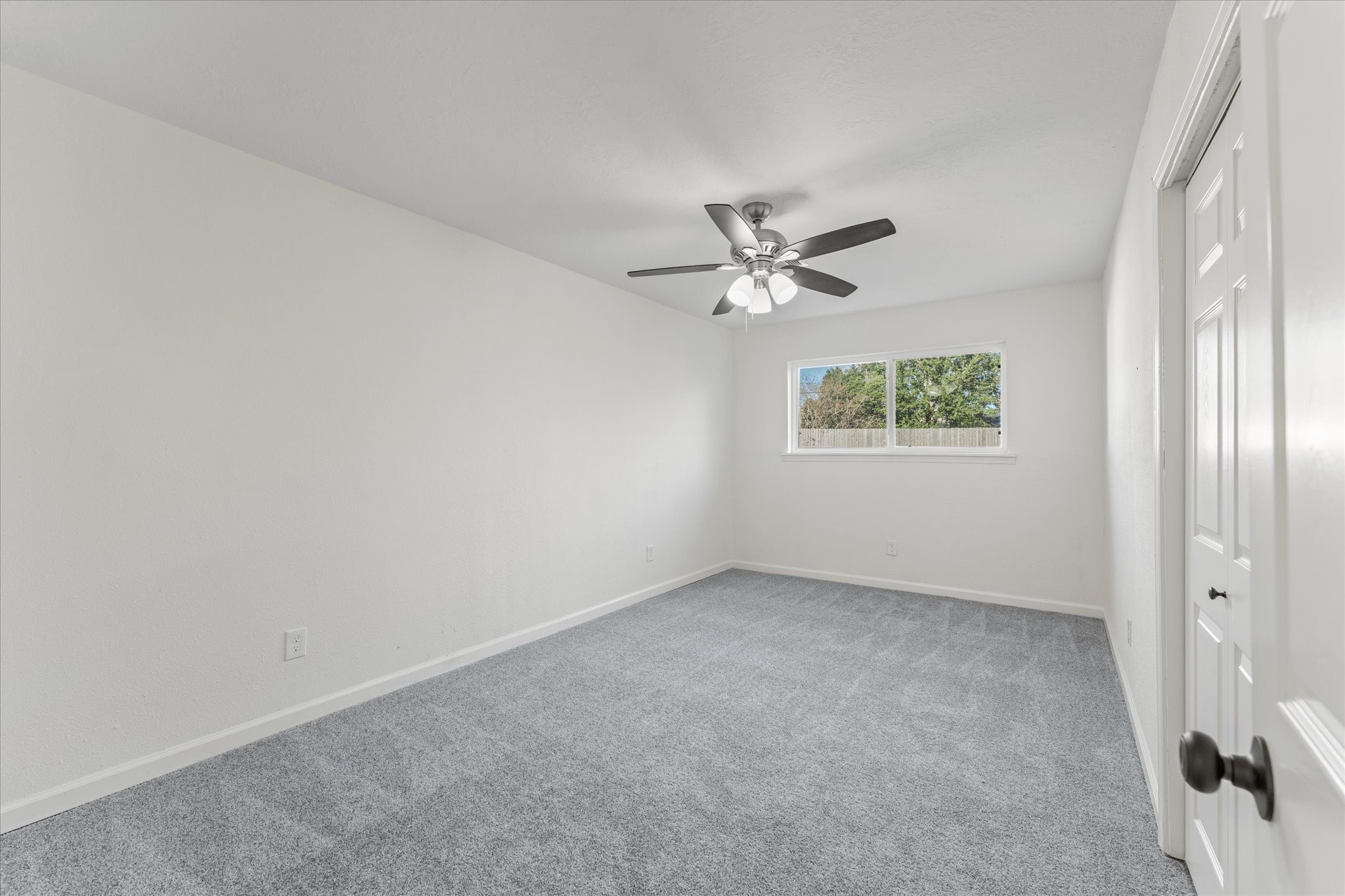 6030 Beaudry Drive Houston, TX 77035 - Photo 28 of 45 an empty room with windows and fan