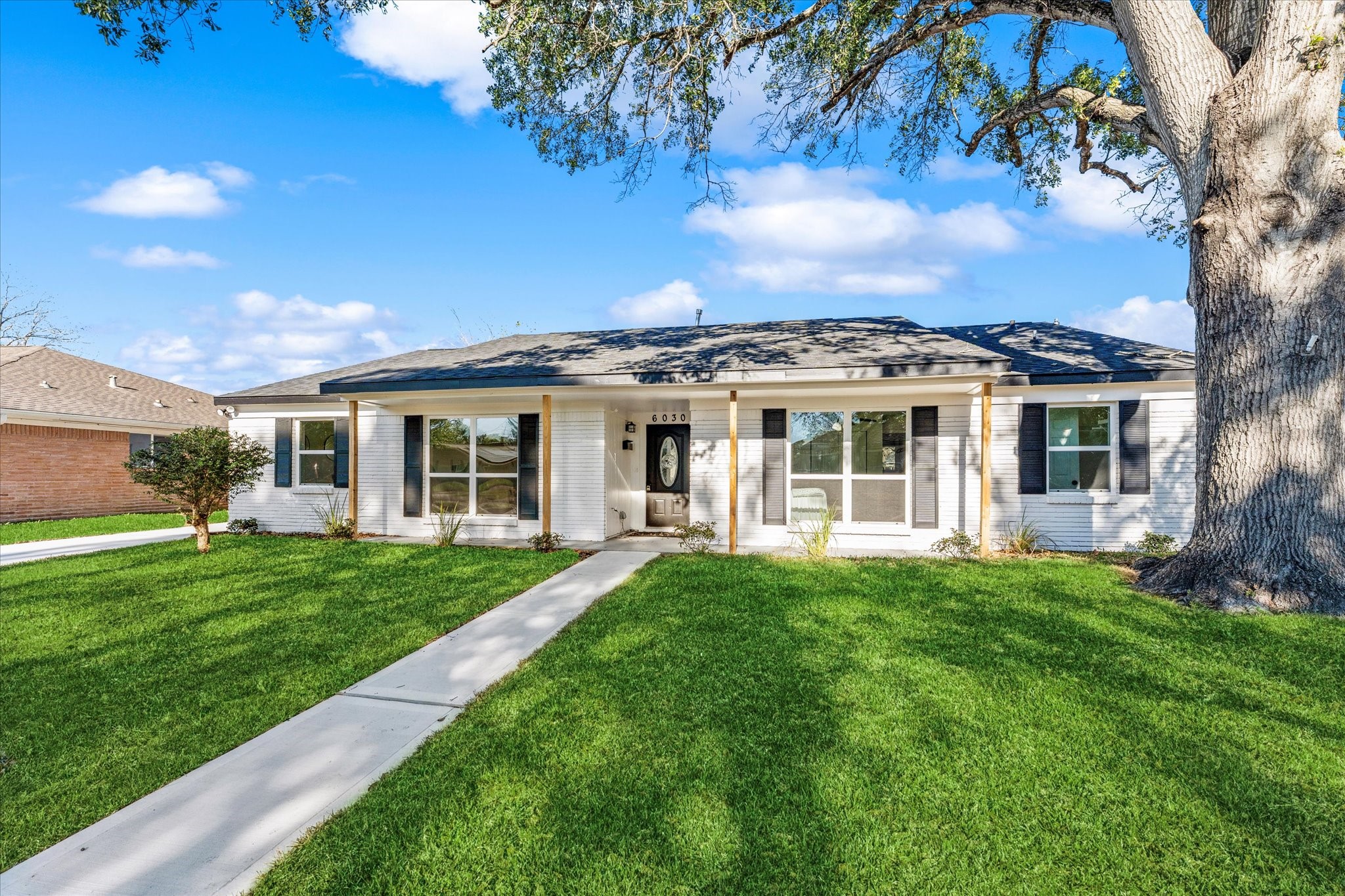 6030 Beaudry Drive Houston, TX 77035 - Photo 3 of 45 front view of a house with a garden