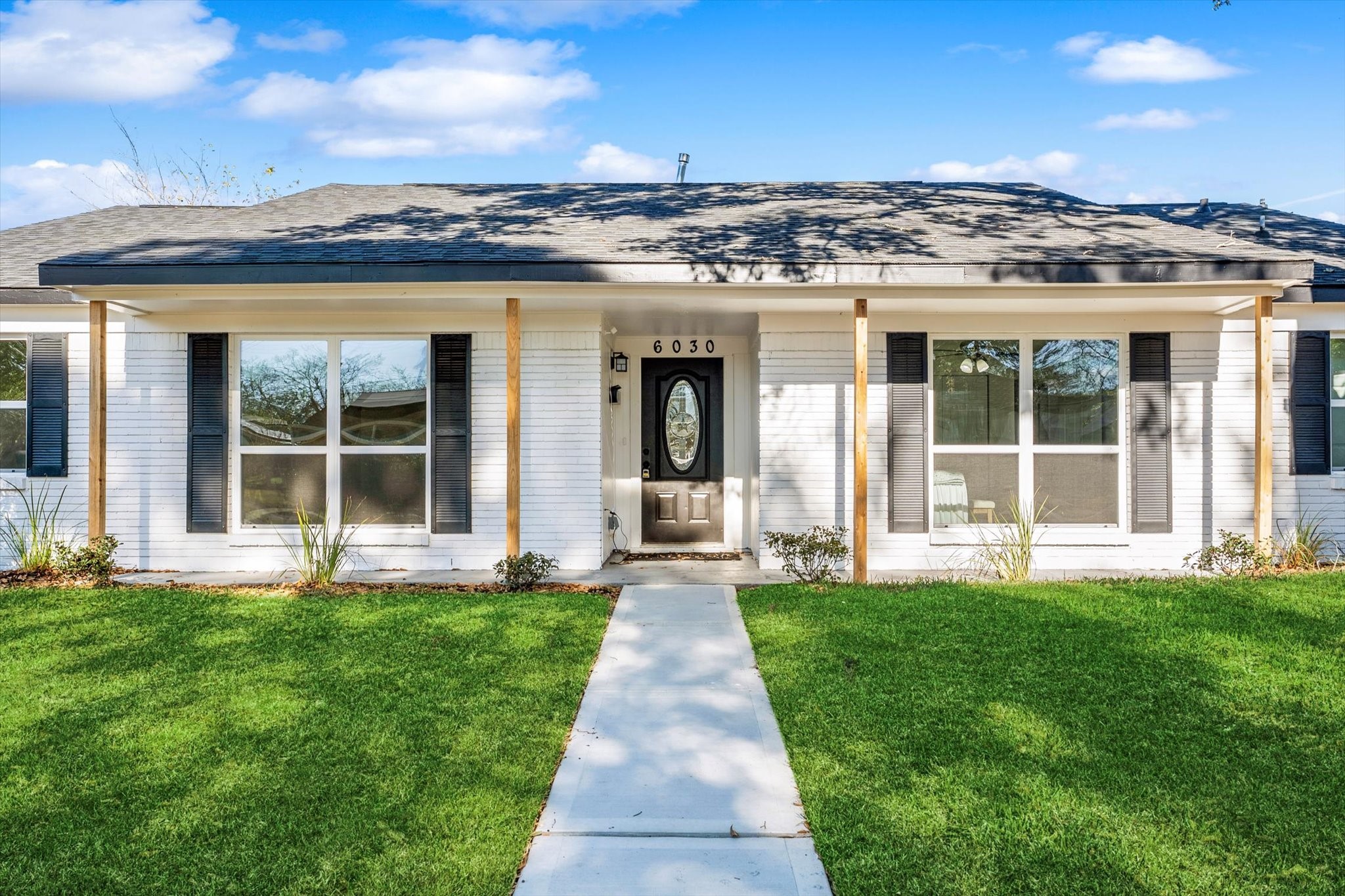 6030 Beaudry Drive Houston, TX 77035 - Photo 4 of 45 a front view of a building with a garden