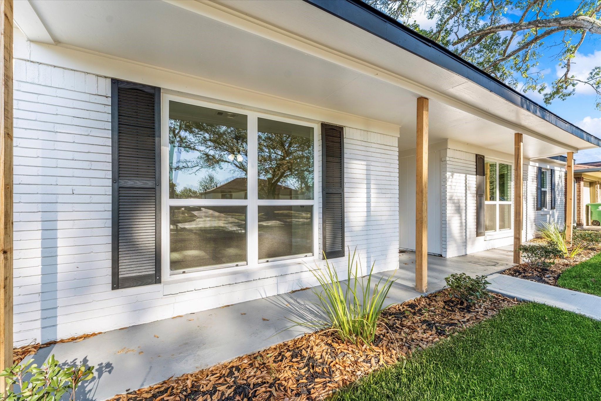 6030 Beaudry Drive Houston, TX 77035 - Photo 5 of 45 a front view of a house with a large window