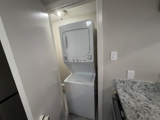 2277 South Kirkwood Road, Unit 104 Houston, TX 77077 - Photo 6 of 12 a utility room with dryer and washer