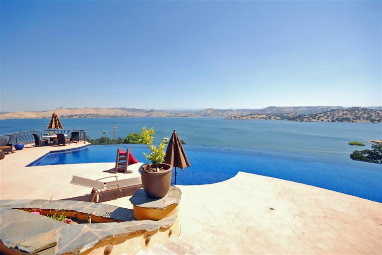 Picturesque Lake views are simply breathtaking and are accentuated by the infinity edge pool.