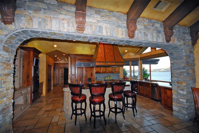 4678 Millerton Road Friant, CA 93626 - Photo 25 of 86 Gourmet Kitchen ~ Enter the Kitchen trough a large stacked stone opening.