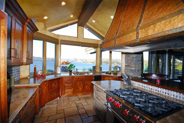 4678 Millerton Road Friant, CA 93626 - Photo 29 of 86 Gourmet Kitchen ~ The Kitchen is anchored by a large center island and beautiful distressed copper hood. The copper "veggie" sink & Wolf range/oven are also found in center island.