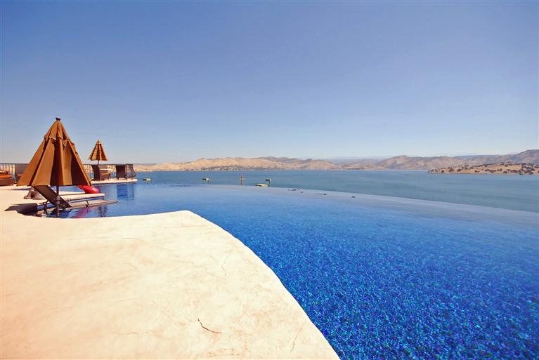One of a kind...Poetic Paradise Imagine relaxing in your infinity pool overlooking the lake.