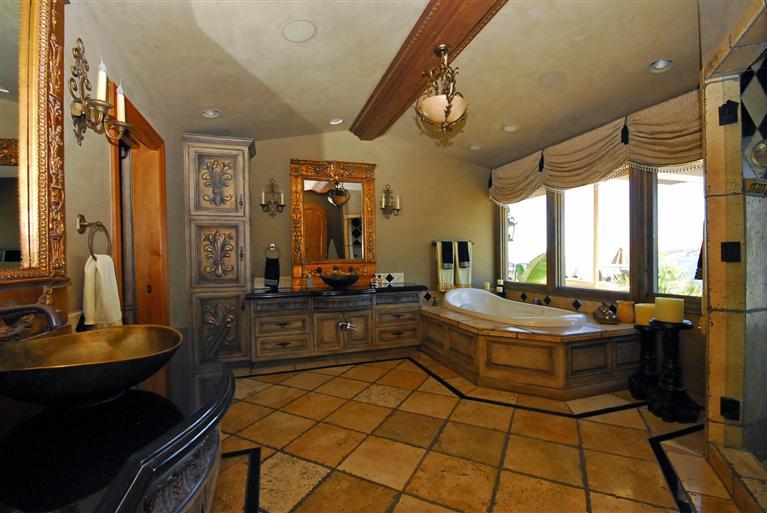 4678 Millerton Road Friant, CA 93626 - Photo 48 of 86 Master Bath has an amazing view featuring steam shower, spa tub, 2 way TV mirror, Lutron lighting, electric shades,imported custom sinks, vaulted ceiling, stone flooring