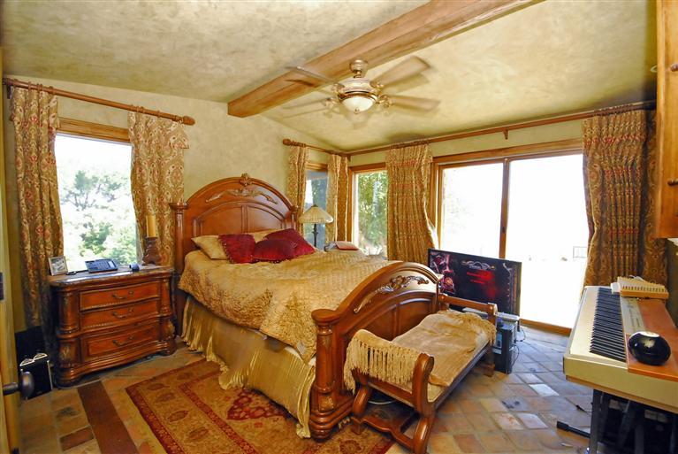 4678 Millerton Road Friant, CA 93626 - Photo 50 of 86 This is the private guest room with imported Italian stone flooring, stone fireplace, private bath and views of the Lake through the sliding glass door leading to one of the patios.