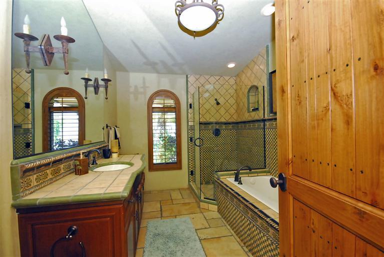 4678 Millerton Road Friant, CA 93626 - Photo 55 of 86 This is the hall bath with beautiful stonework separte shower and bath.